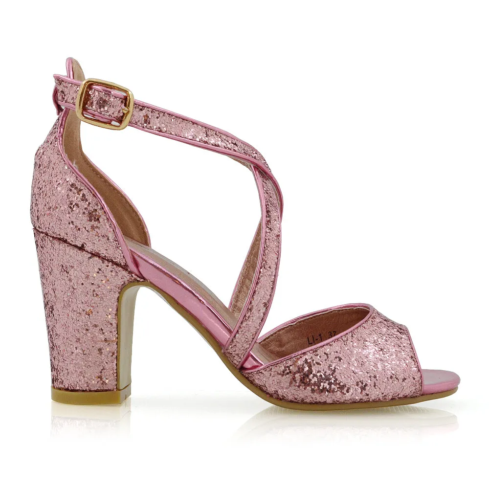 HARLOW CROSS OVER STRAPPY BUCKLE PEEP TOE BLOCK HIGH HEELS IN PINK GLITTER